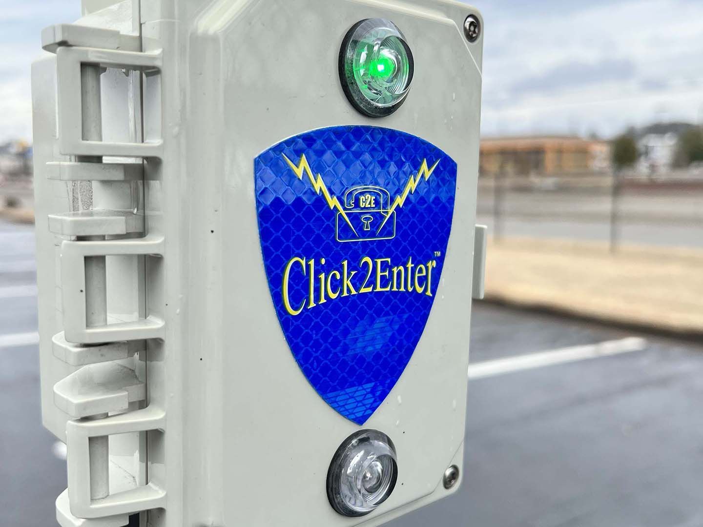 A white box with a blue sticker that says click 2 enter