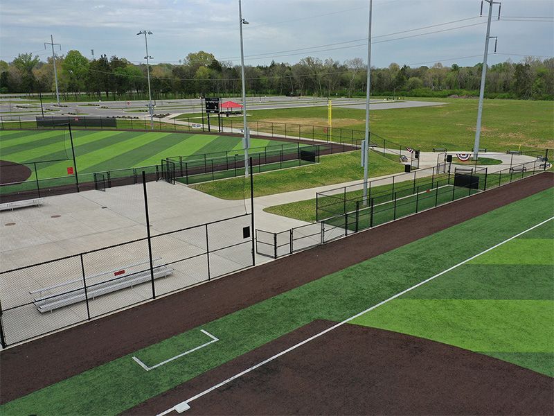 An aerial view of a baseball field with a fence around it