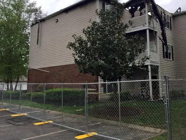 A building with a chain link fence around it