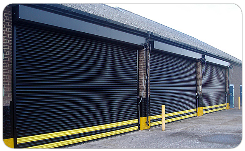 Three black and yellow industrial roller shutter garage doors