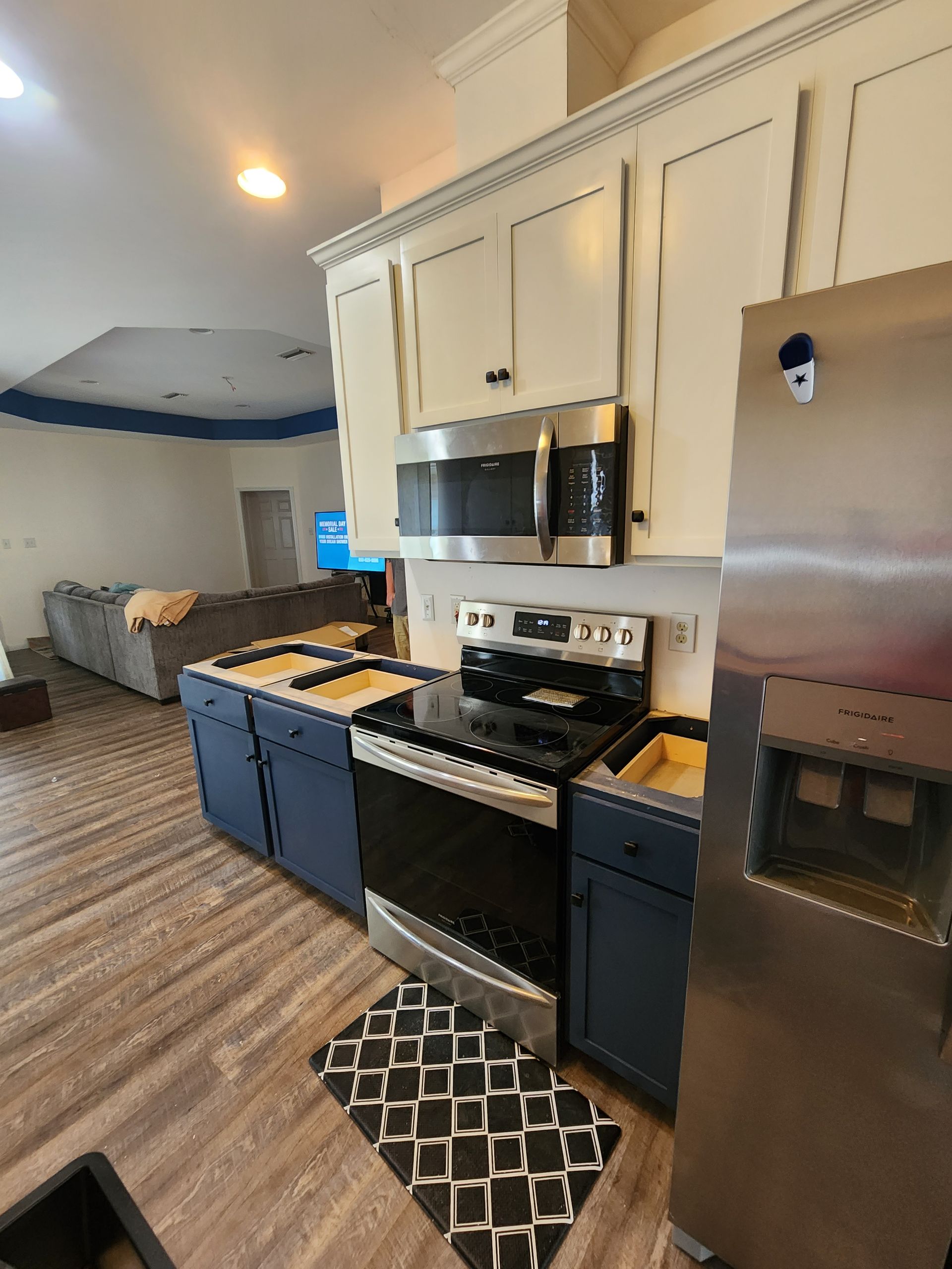 A kitchen cabinet with a corner shelf that is open