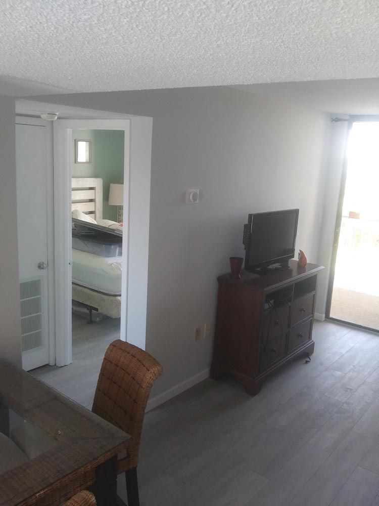 A living room with a television and a couch