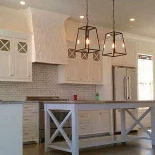 There is a large island in the middle of the kitchen.