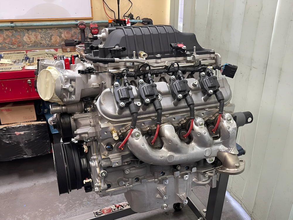 A Large Engine Is Sitting On A Stand In A Room — Hunter Automotive In Bungalow, QLD
