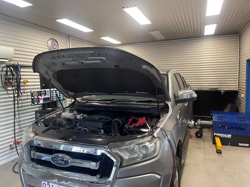 A Ford Ranger With Its Hood Up In A Garage — Hunter Automotive In Bungalow, QLD