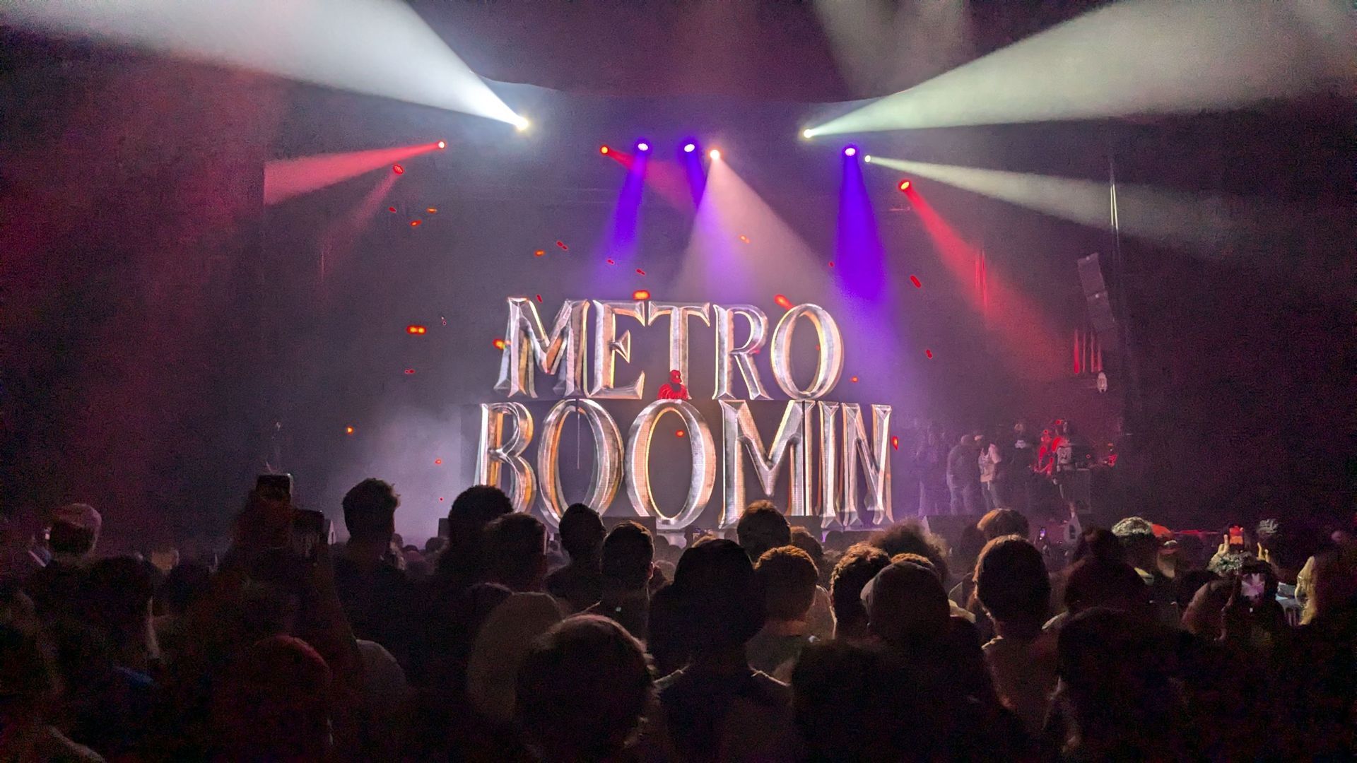 Crowd at Metro Boomin concert; stage with 