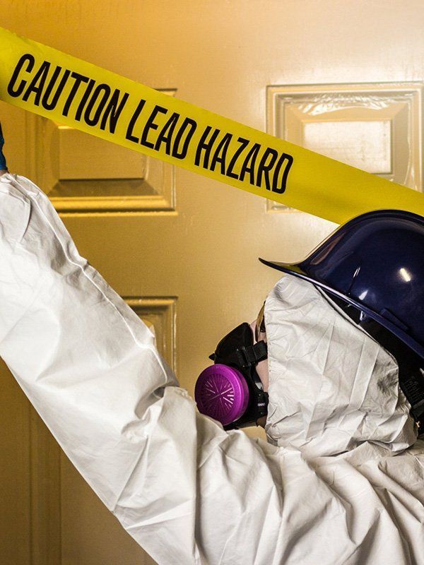 Person in Protective Suit, Respirator, and Hard Hat — CJD Investments (NQ) Pty Ltd in Mackay Harbour, QLD