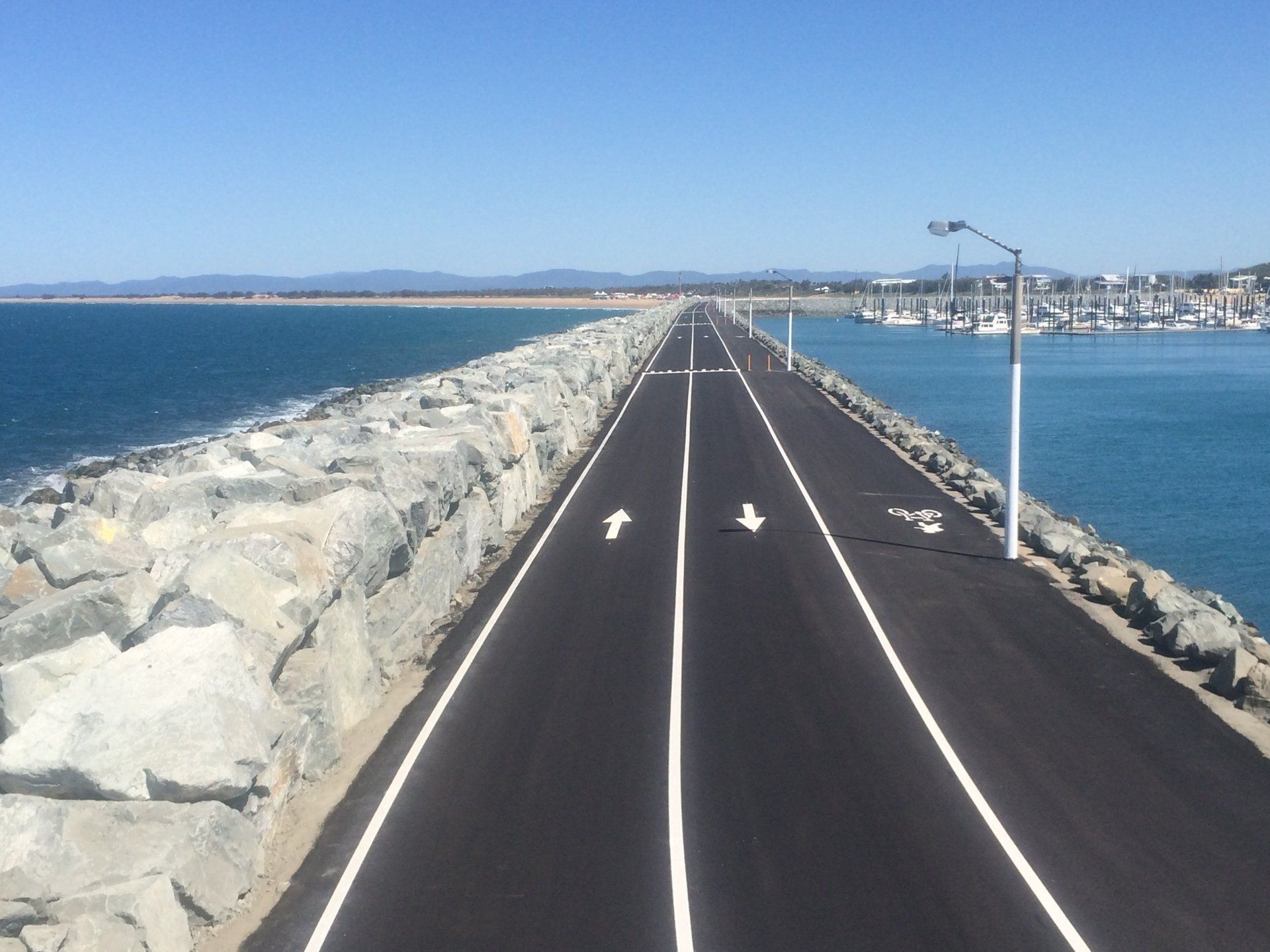 Paved Pathway on a Stone Breakwater With Ocean Views — CJD Investments (NQ) Pty Ltd in Mackay Harbour, QLD