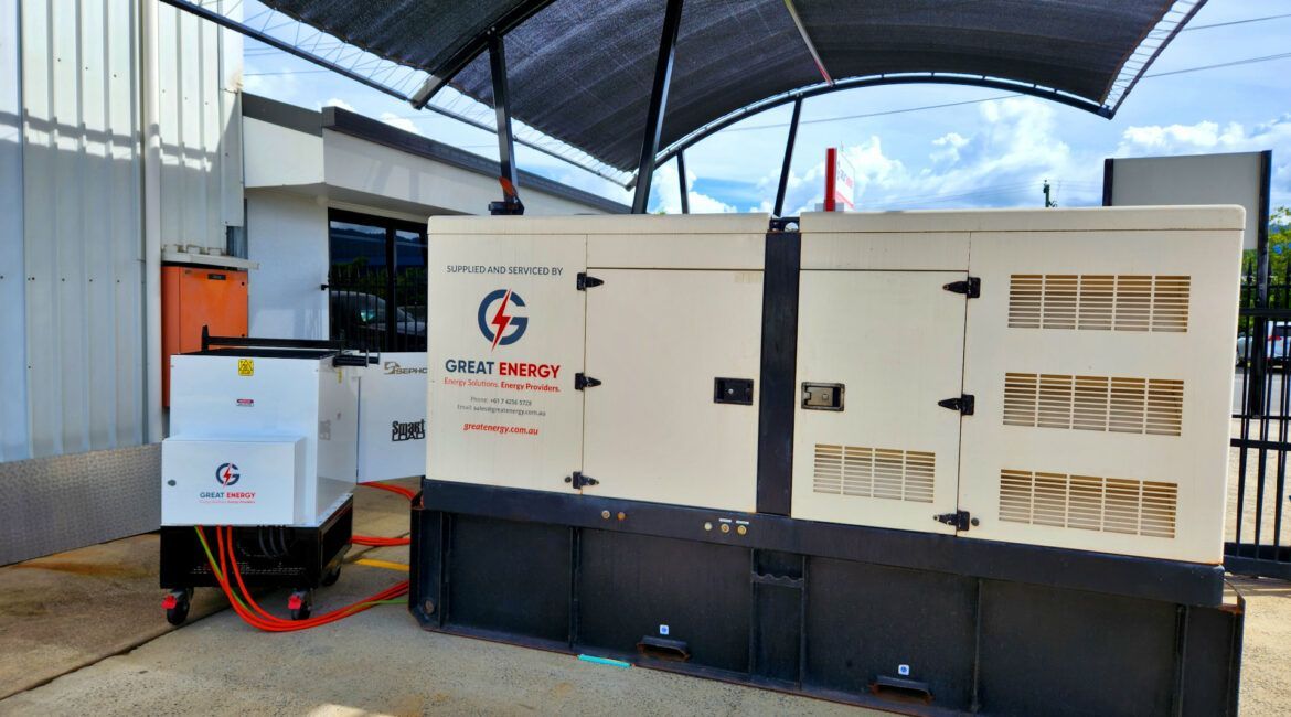 A Generator Is Sitting Under A Canopy In Front Of A Building — Great Energy in Portsmith, QLD