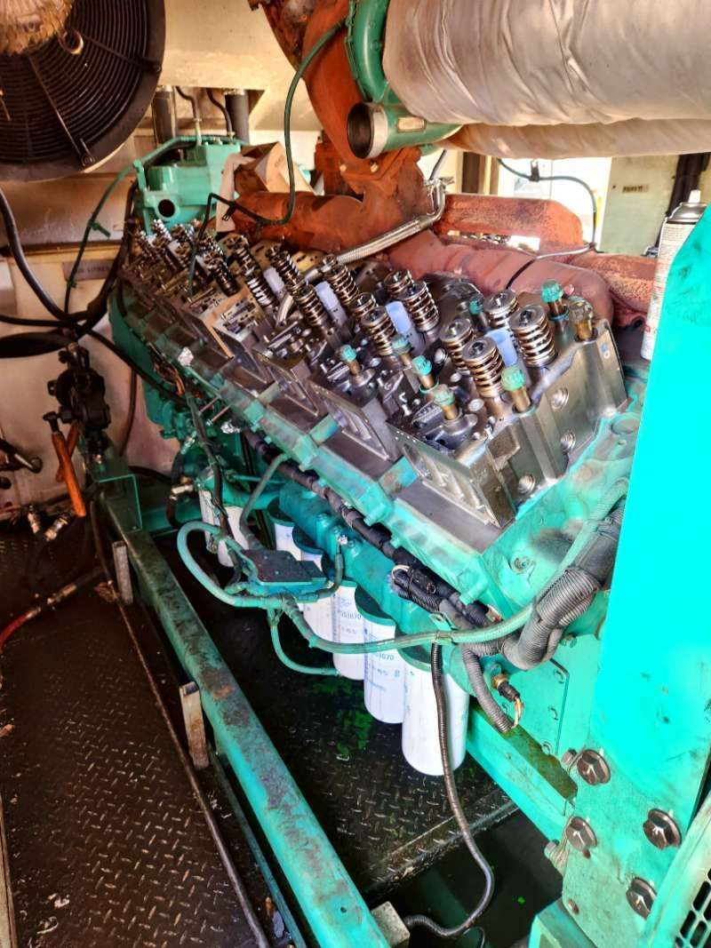 A Large Green Engine Is Being Worked On In A Room — Great Energy in Cairns, QLD