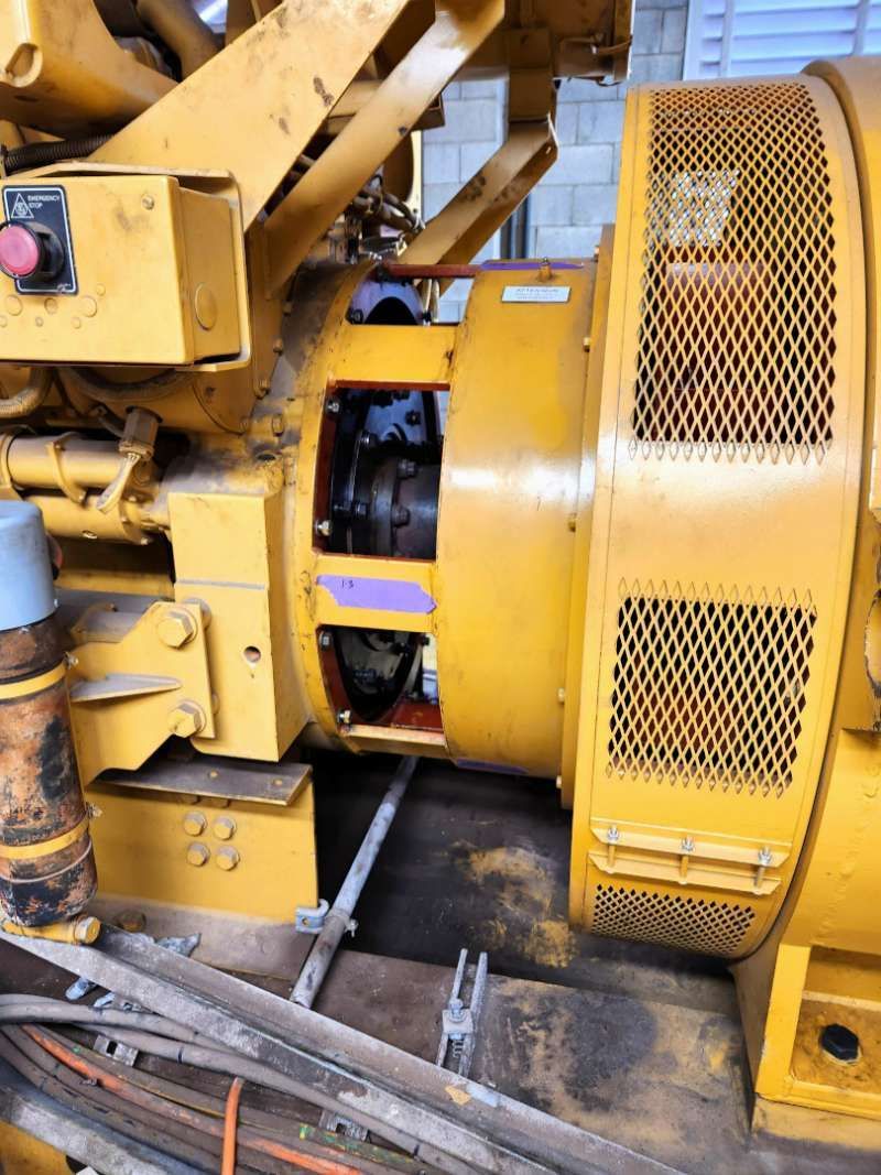 A Large Yellow Machine Is Sitting On A Wooden Floor — Great Energy in Portsmith, QLD