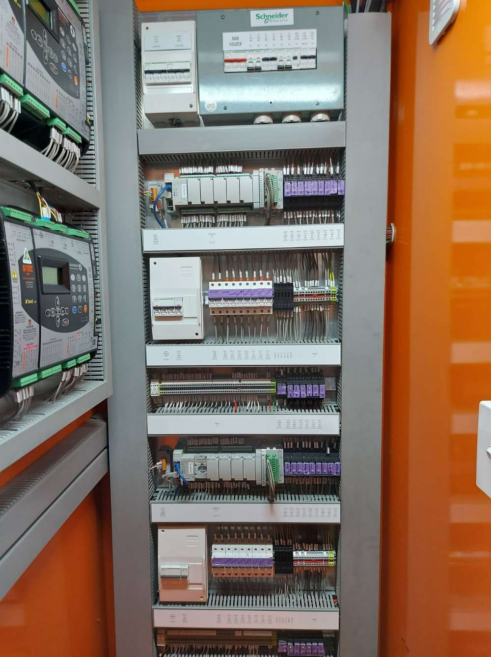 A Row Of Shelves Filled With Electrical Equipment In A Room — Great Energy in Cairns, QLD