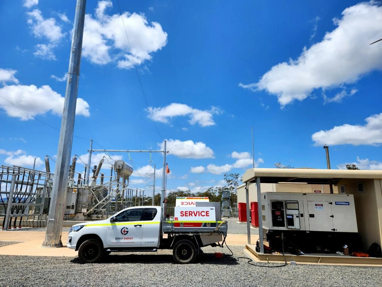A White Truck Is Parked In Front Of A Power Station — Great Energy in Townsville, QLD
