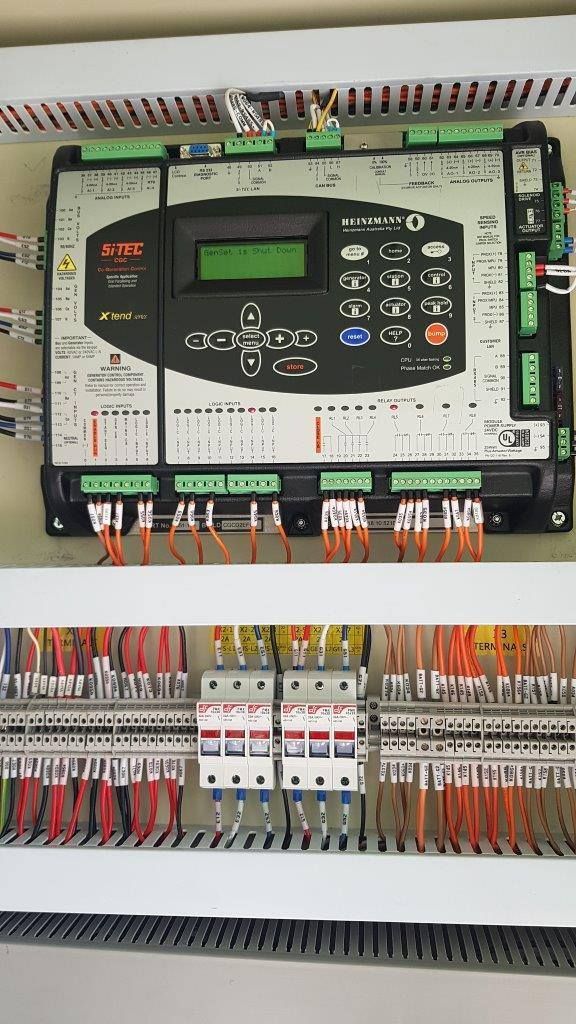A Close Up Of A Control Panel With A Lot Of Wires Coming Out Of It — Great Energy in Portsmith, QLD