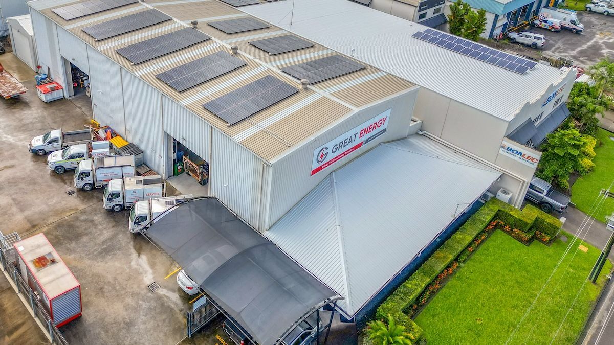 An Aerial View Of A Large Building With Trucks Parked In Front Of It — Great Energy in Innisfail, QLD
