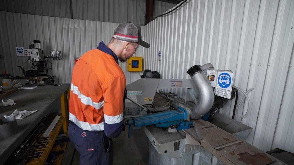 A Bunch Of Spools Of Wire Are Lined Up On A Rack — Great Energy in Portsmith, QLD