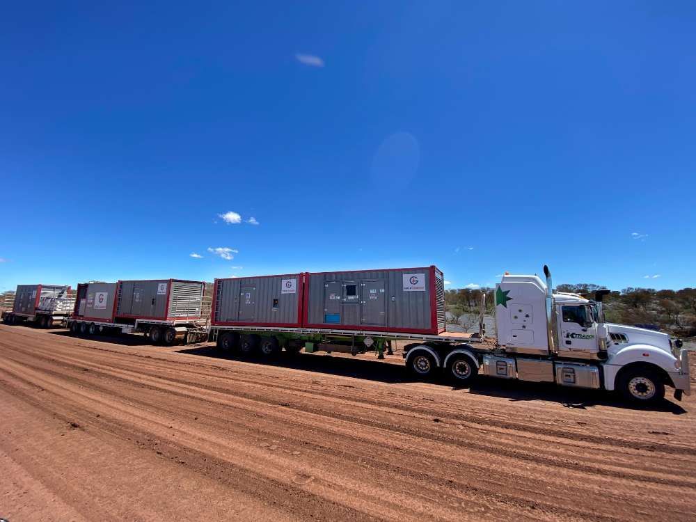 A Row Of Semi Trucks Are Parked On A Dirt Road — Great Energy in Portsmith, QLD