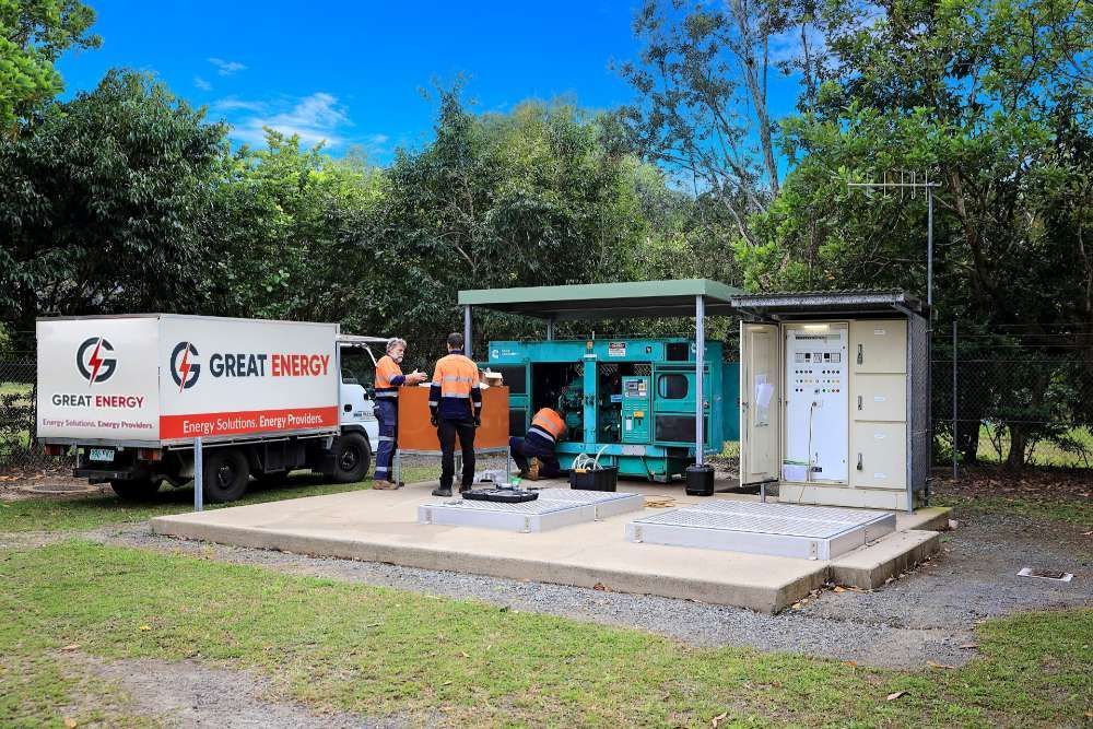 A Great Energy Truck Is Parked Next To A Generator — Great Energy in Portsmith, QLD
