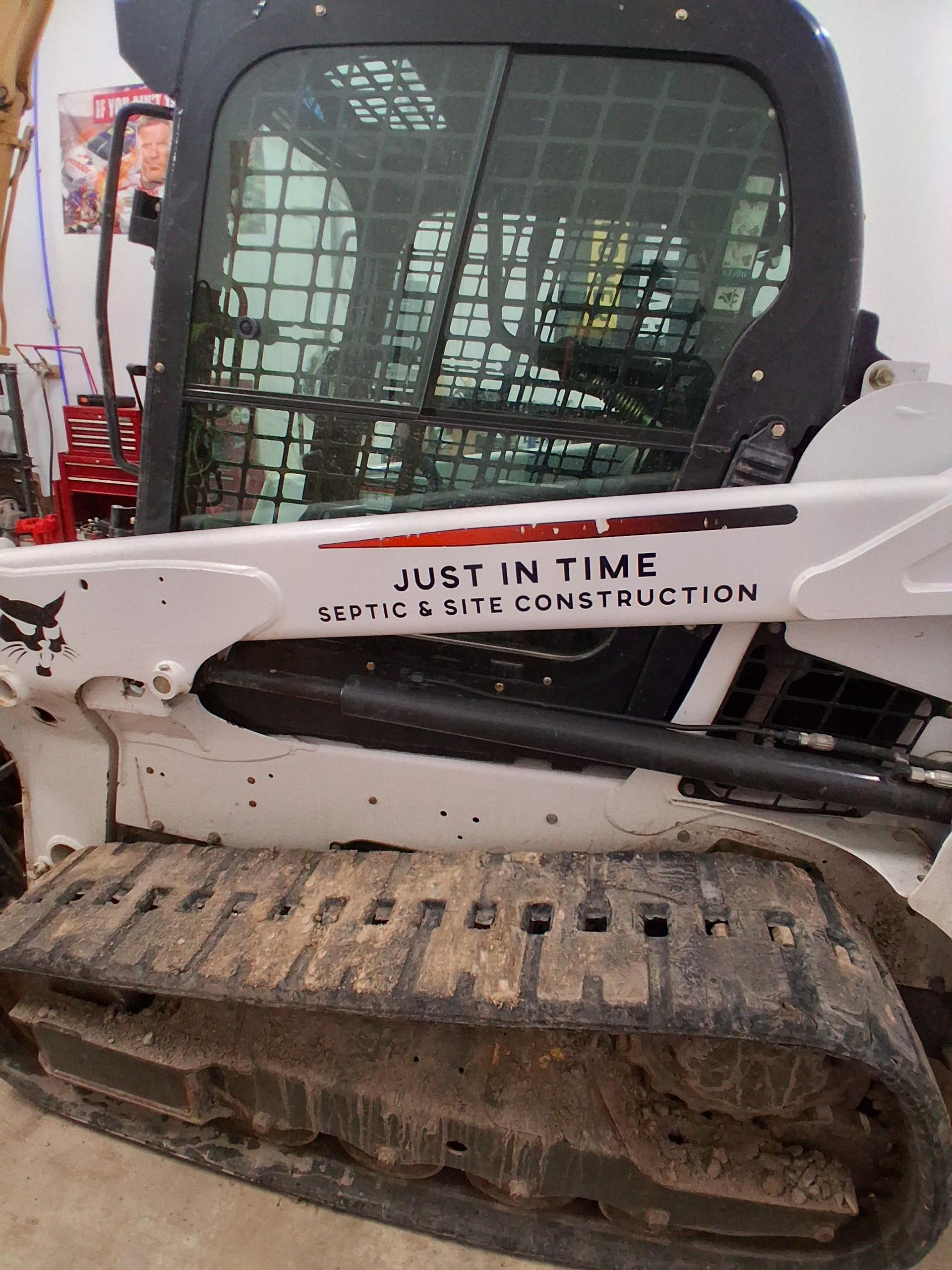 A bulldozer with just in time written on the side