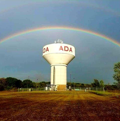 Iconic Water Tower in Ada, Oklahoma with rainbow in the sky