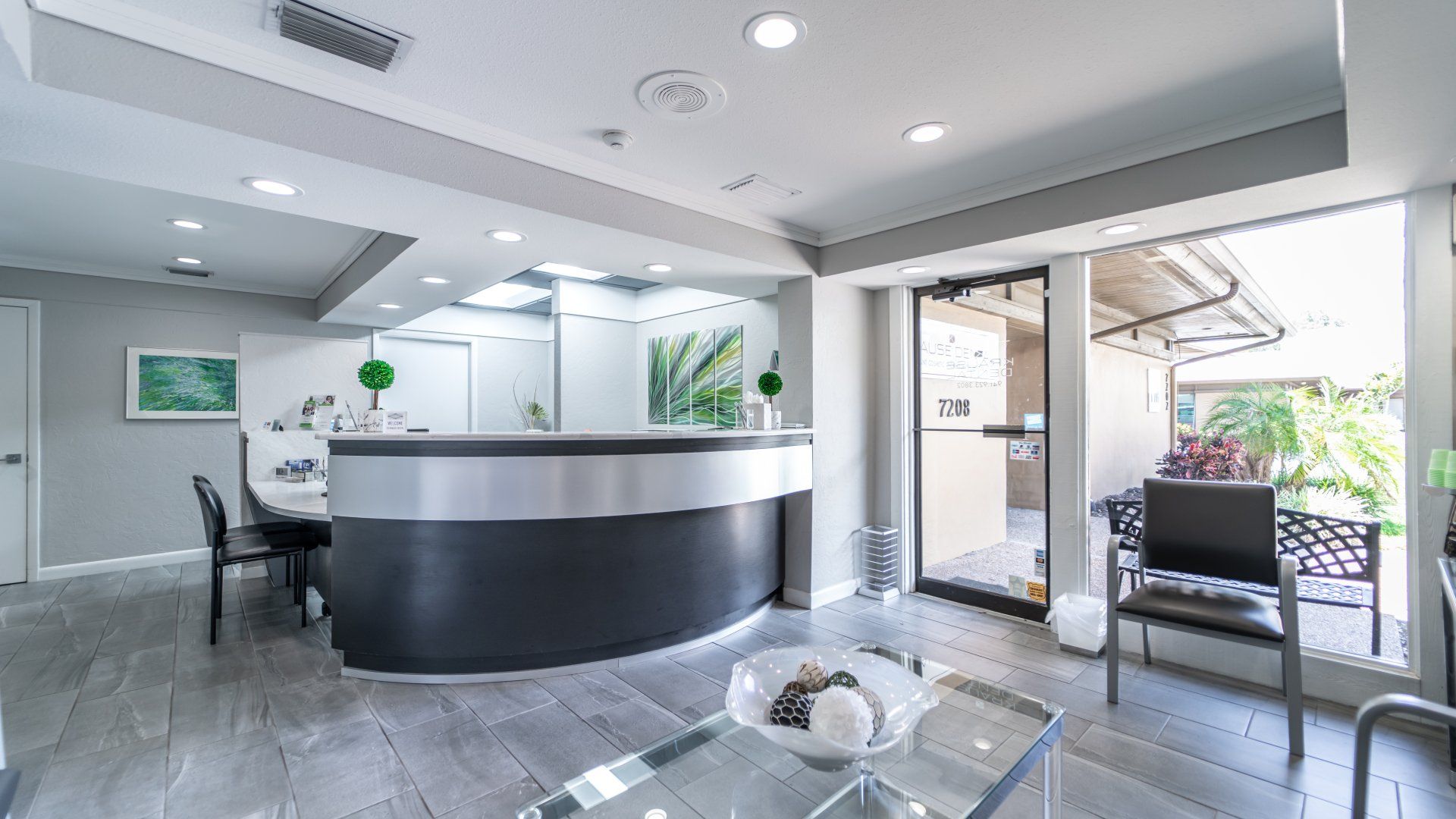 There is a reception desk in the middle of the room.