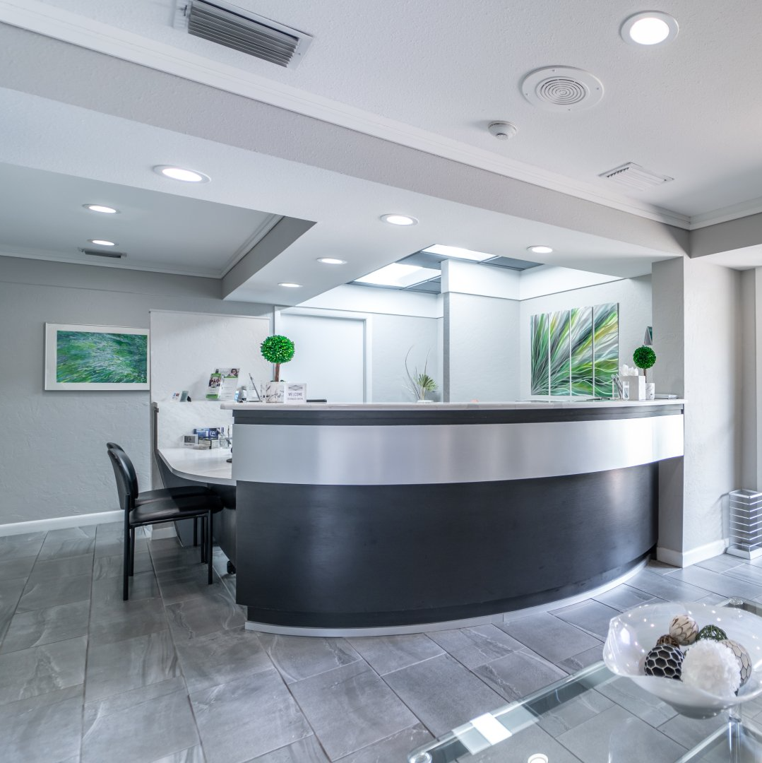 There is a large curved counter in the middle of the room.