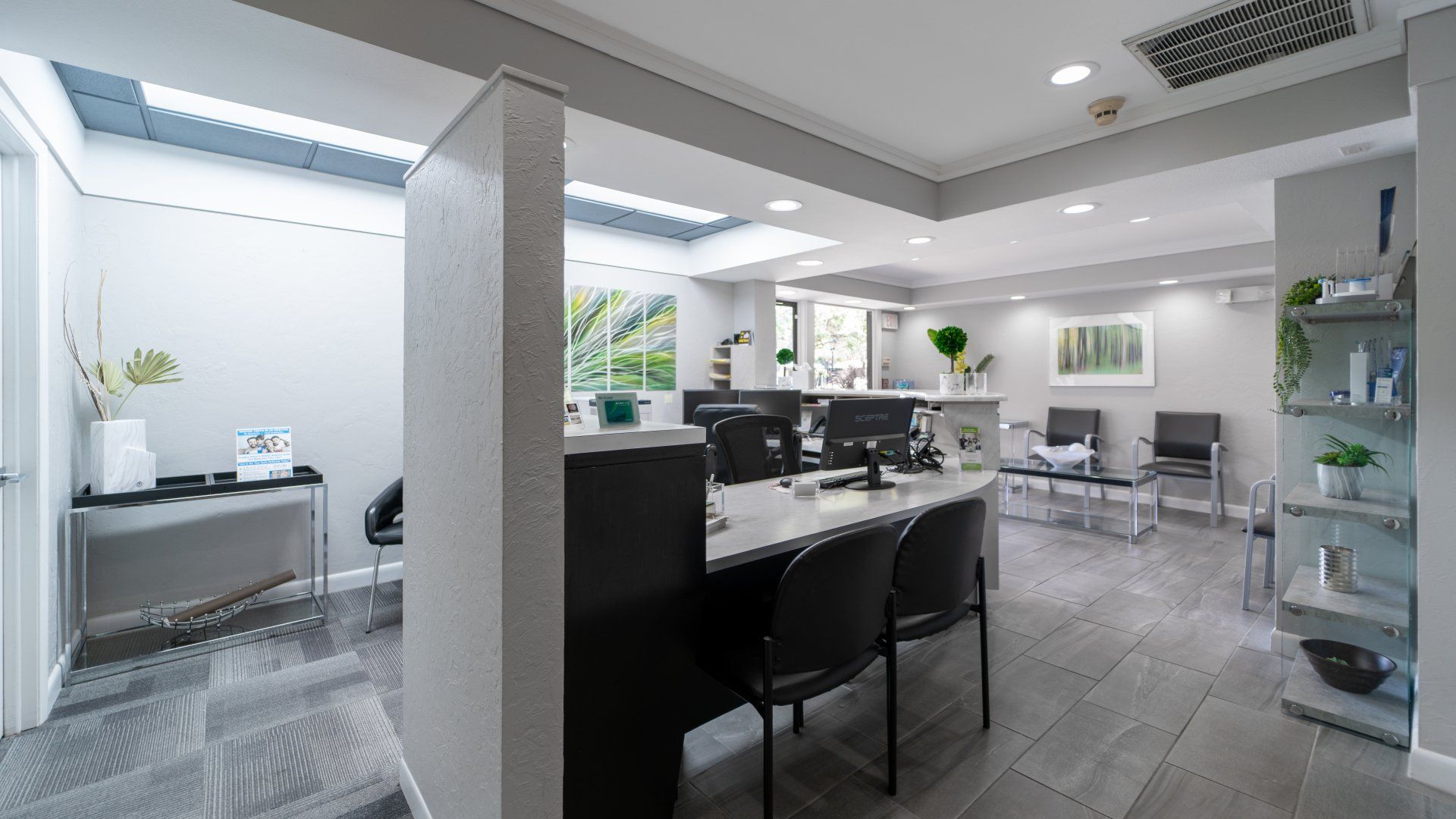 A large room with a table and chairs in it.