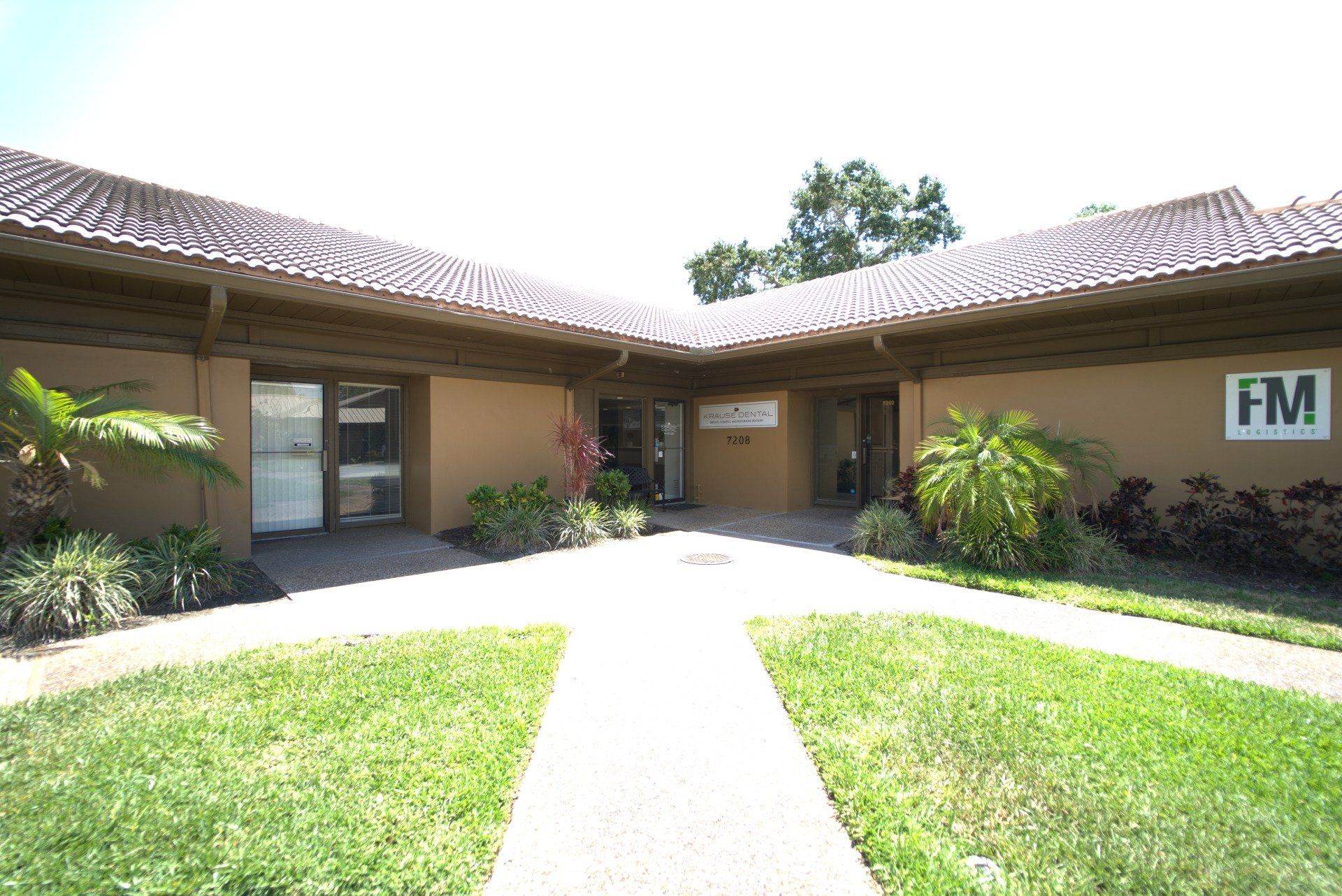 A large building with a fm sign on the side of it