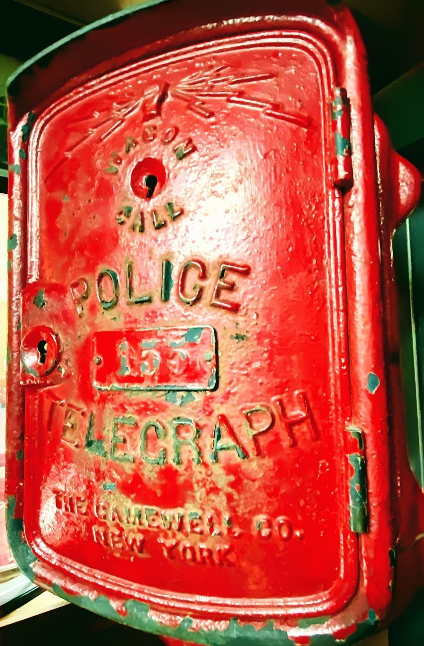 Red police telegraph call box with the words 