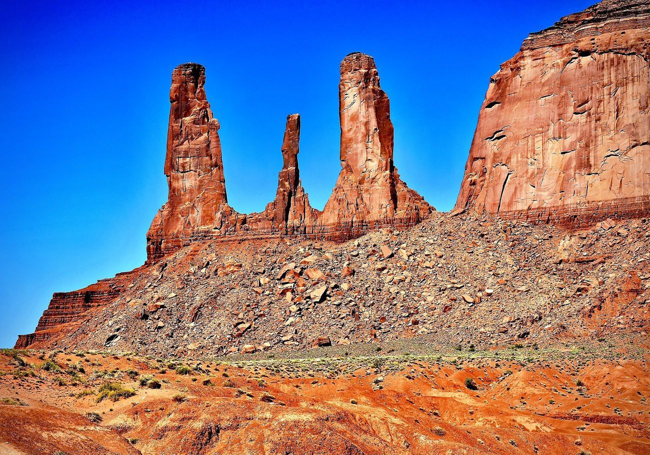 Red rock formations against a bright blue sky. Desert landscape.
