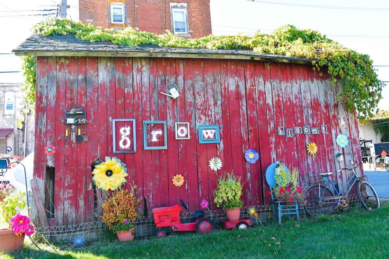 Red, weathered shed with the word