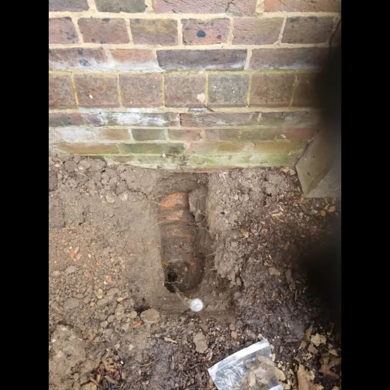 hole dug next to a wall