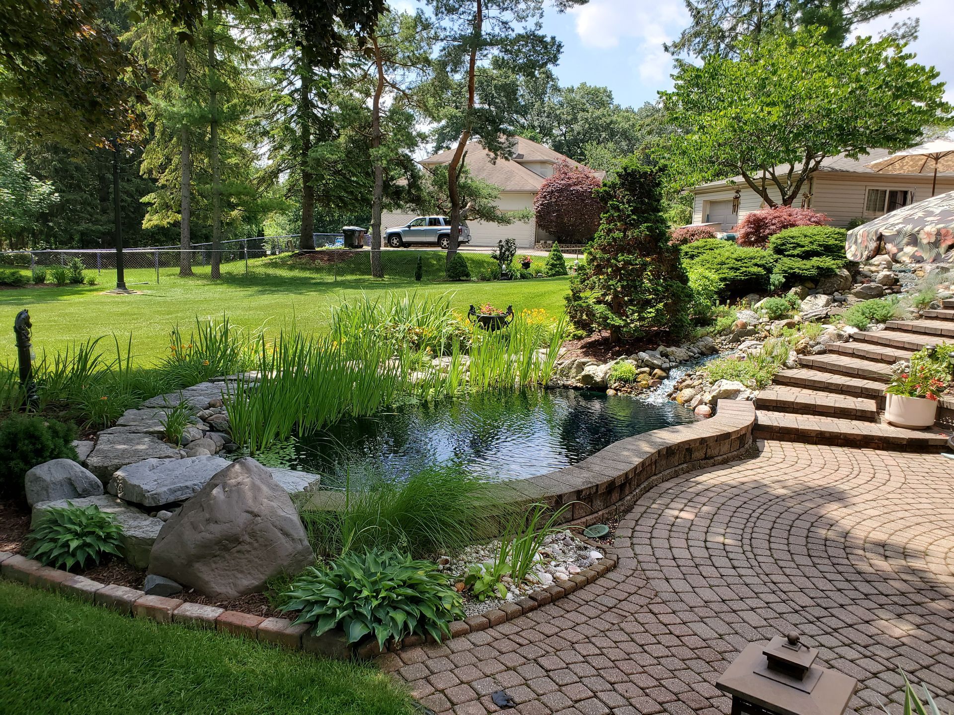 There is a pond in the middle of the garden.