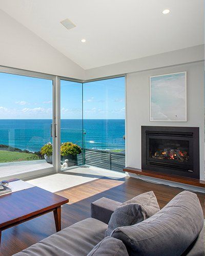 gas log fireplace with overlooking views of the ocean