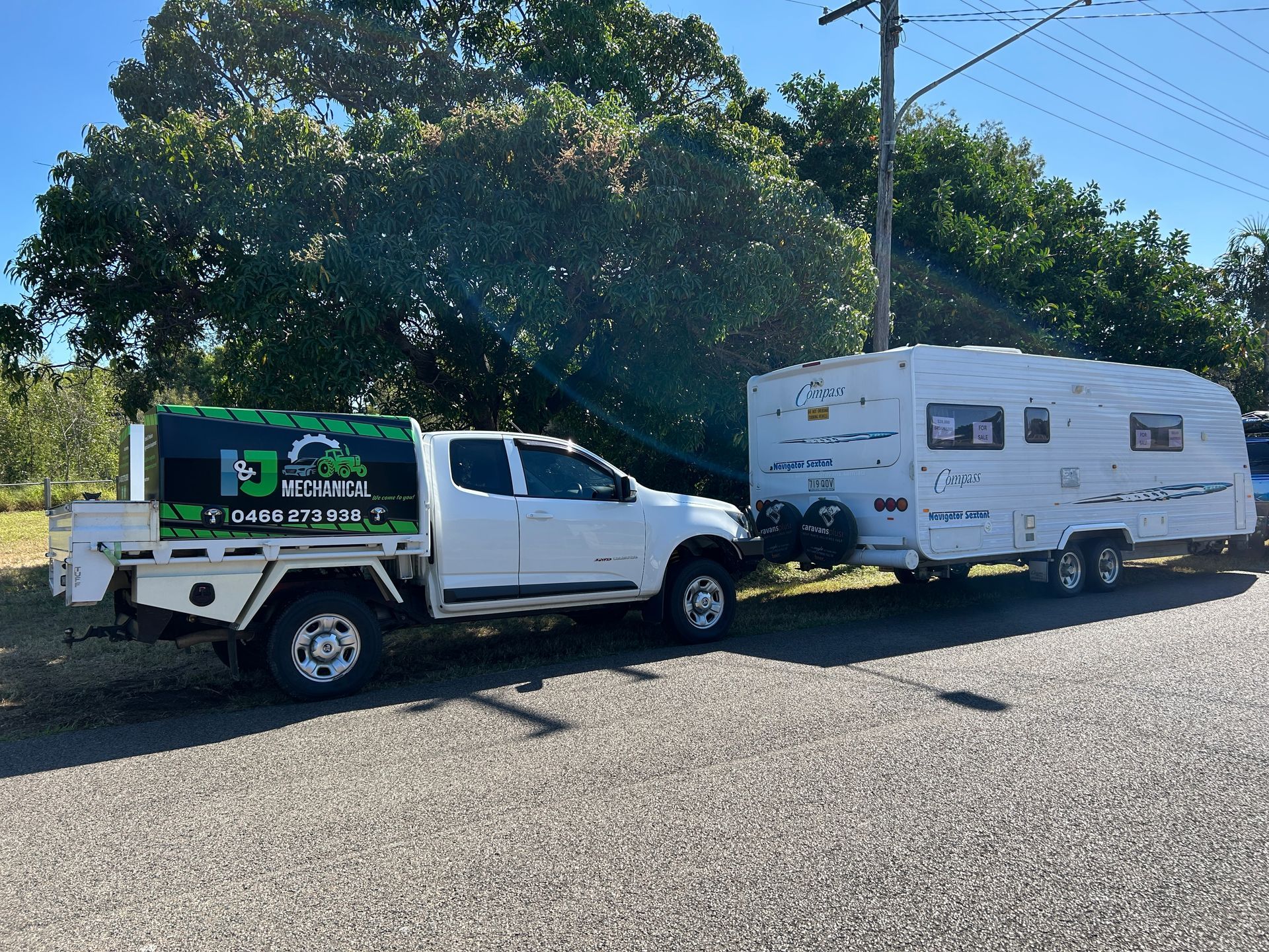 RV Parked Outdoors with work car behind it — I & J Mechanical in Deeragun, QLD