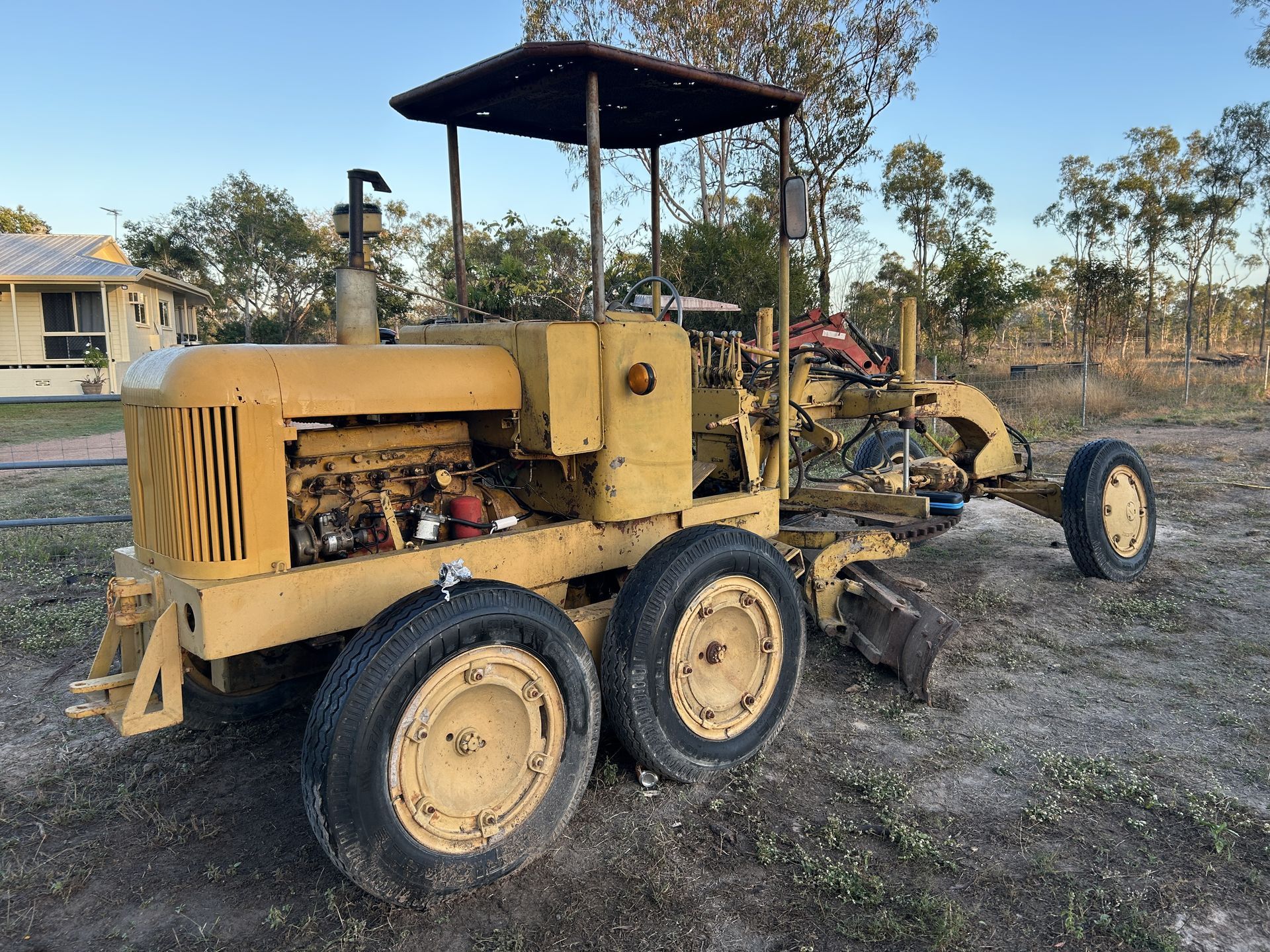 A Yellow Machine in a dirt yard — I & J Mechanical in Deeragun, QLD