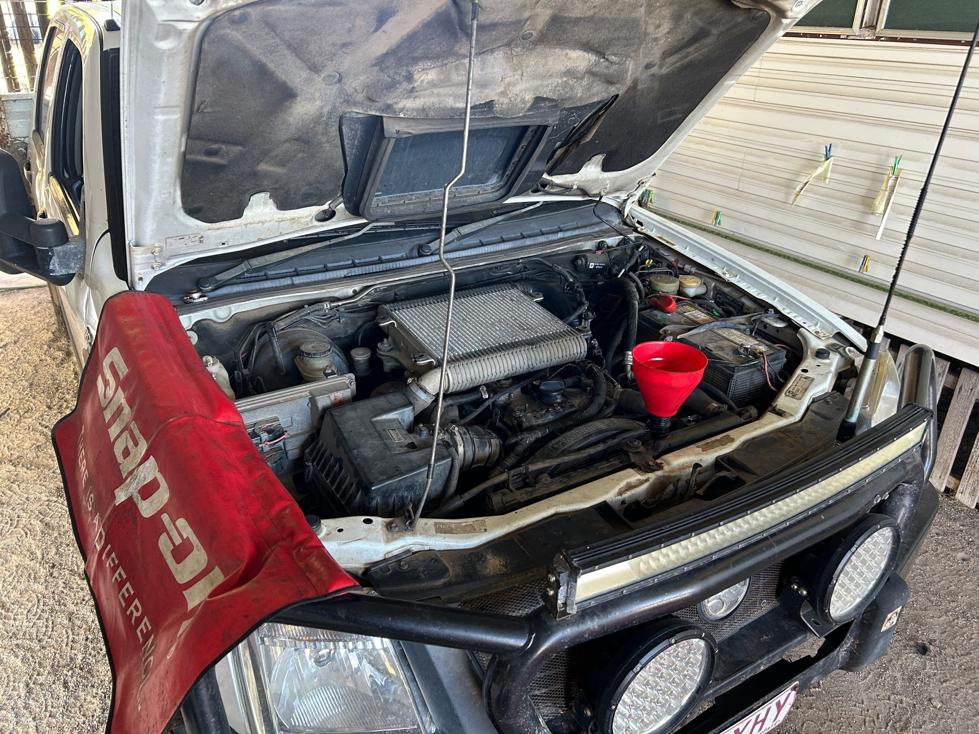 White car with the front bonnet up  — I & J Mechanical in Deeragun, QLD
