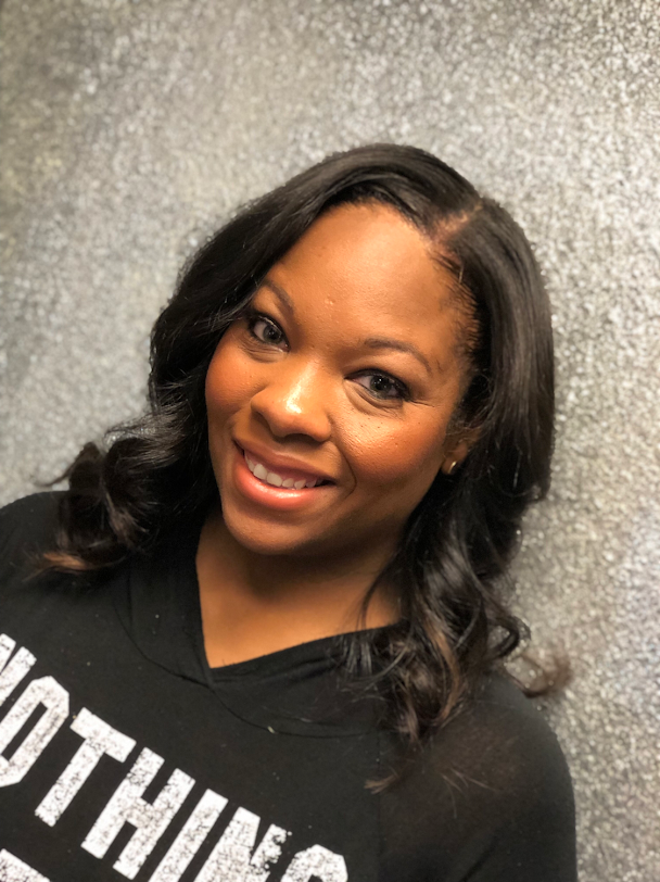 A woman wearing a black shirt with the word nothing on it