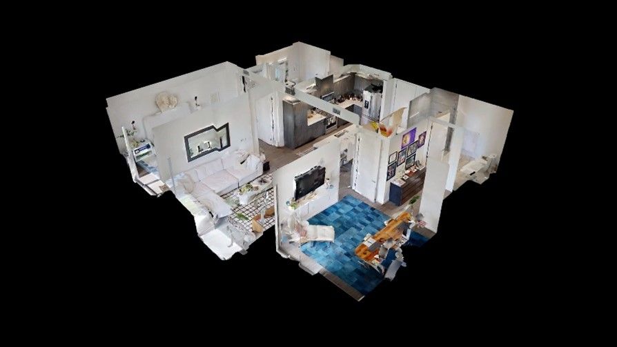 A 3d model of a house with a living room, dining room, and kitchen