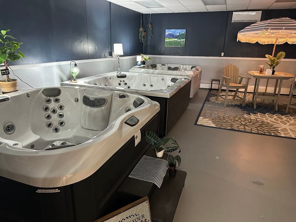 A room filled with lots of hot tubs and umbrellas.