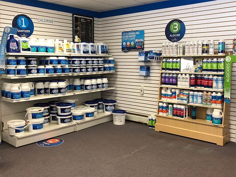 A store filled with shelves filled with lots of pool supplies.
