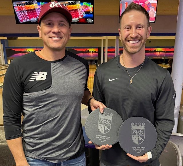 Baseball on a dark surface, with visible stitching.