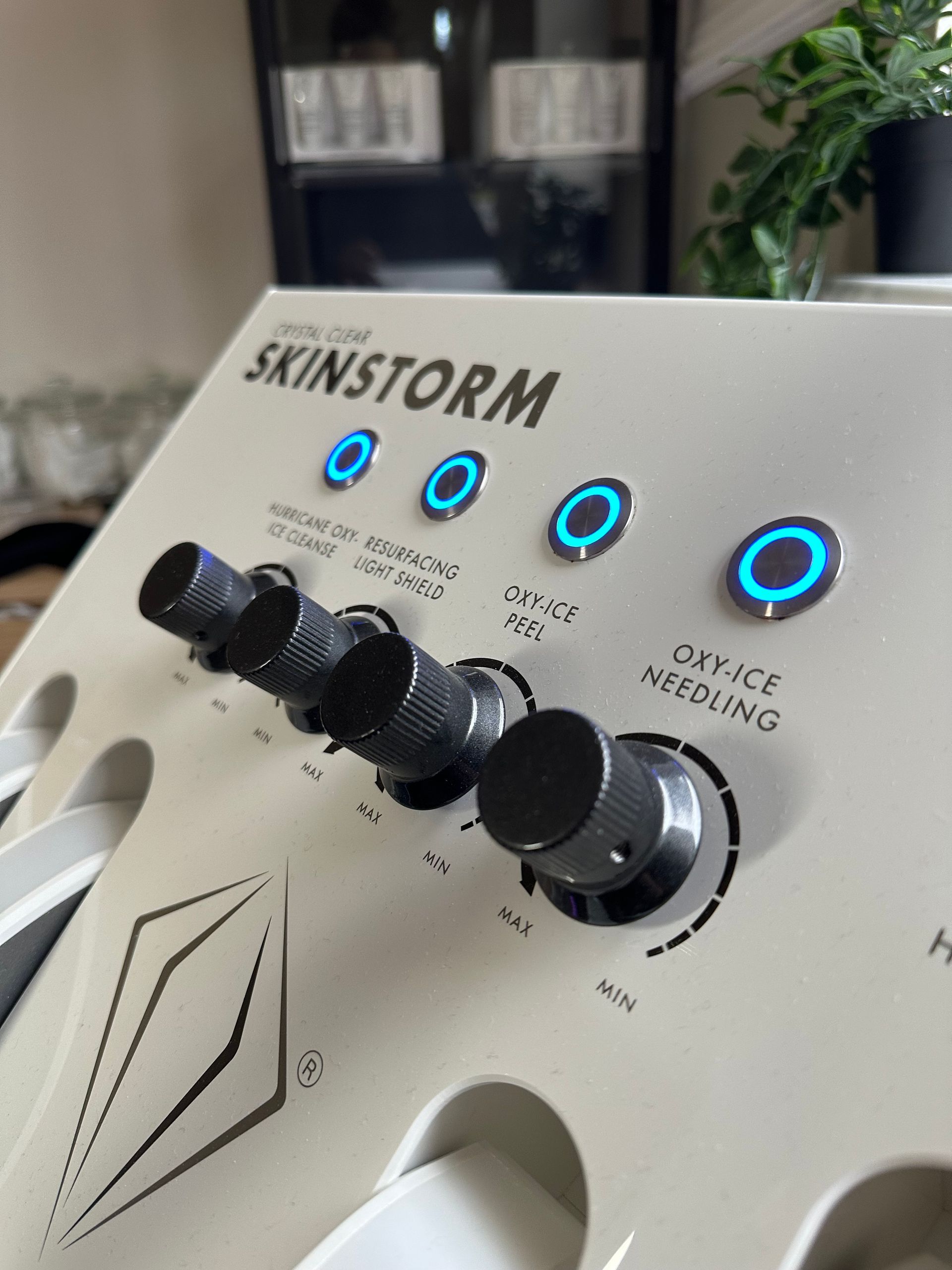A close up of a skinstorm device with buttons and knobs
