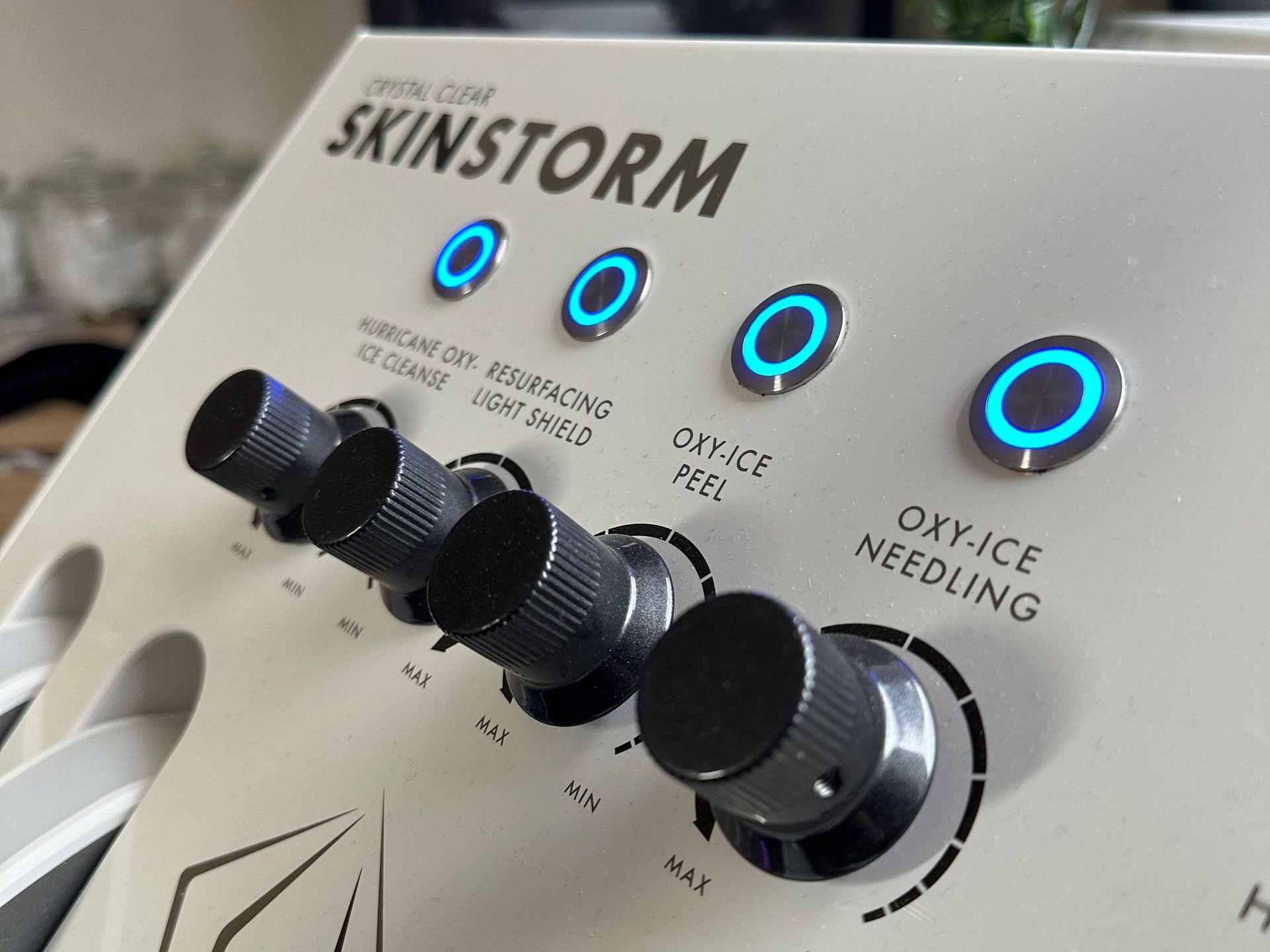 A close up of a skinstorm device with buttons and knobs