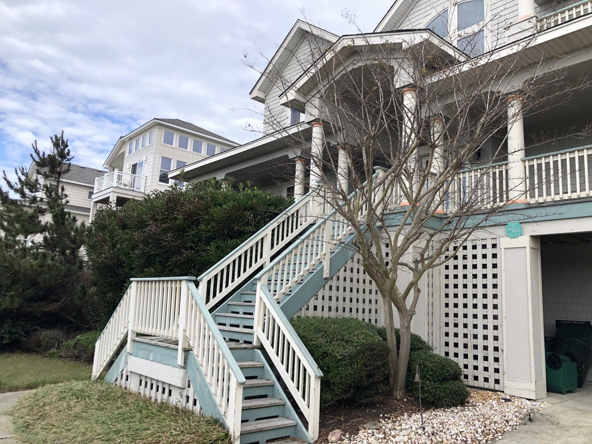 Before photo of front stairs and decking prior to painting and updating