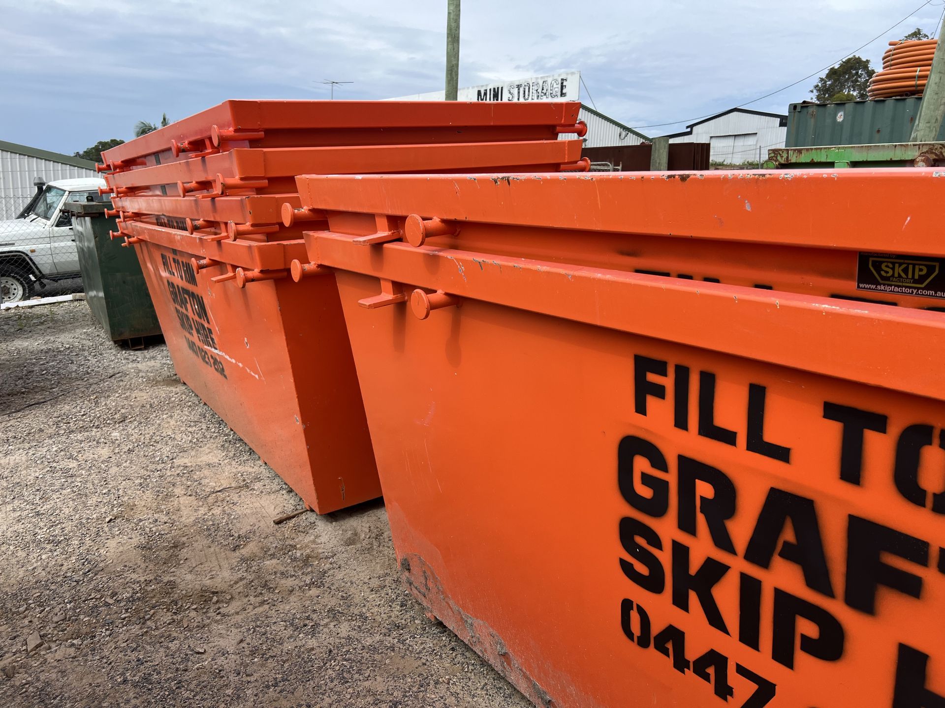Orange skip bins in a yard— Grafton Skip Hire–Zims Bins in South Grafton, NSW