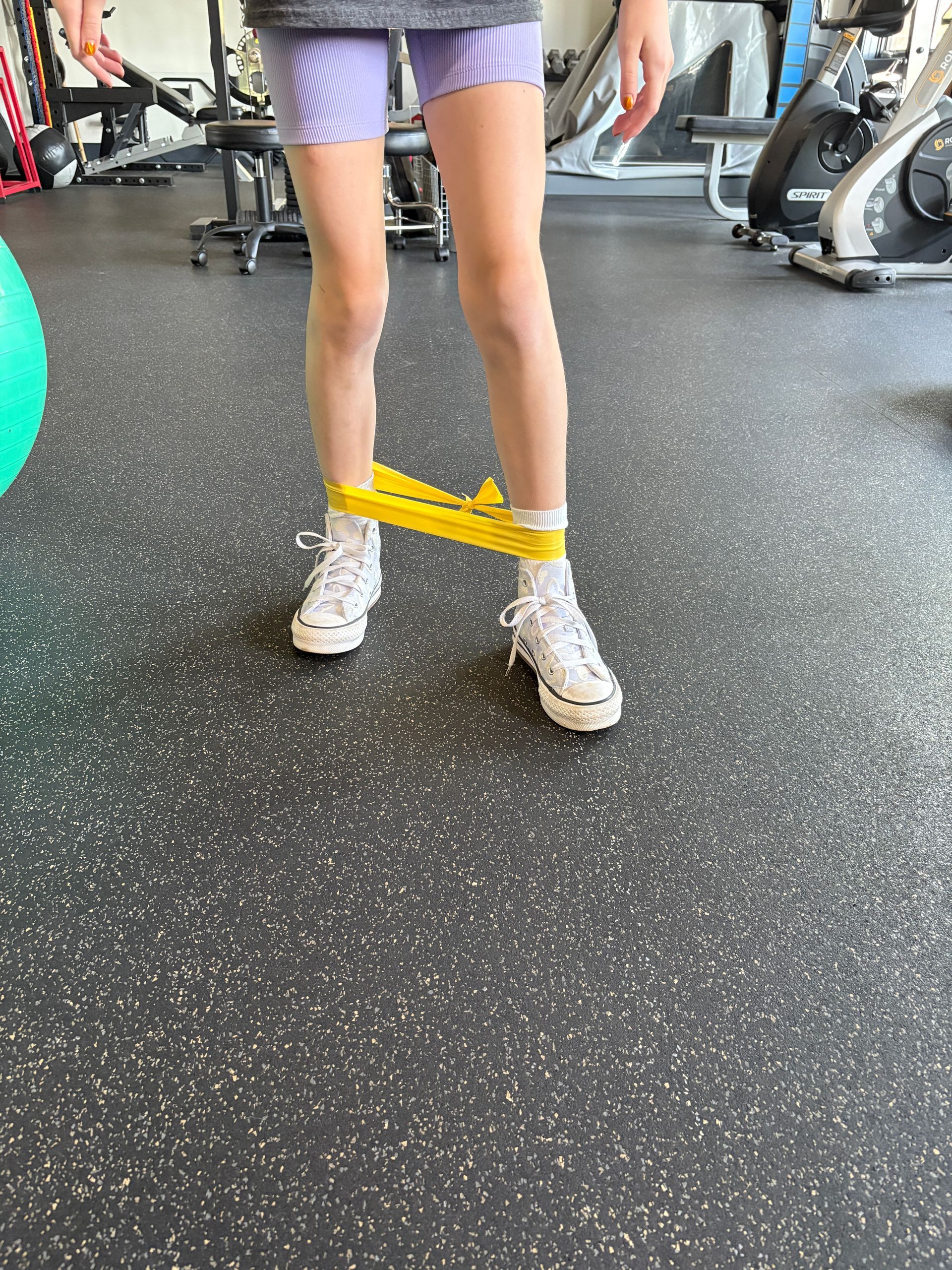 young athlete doing physical therapy to help her recover faster