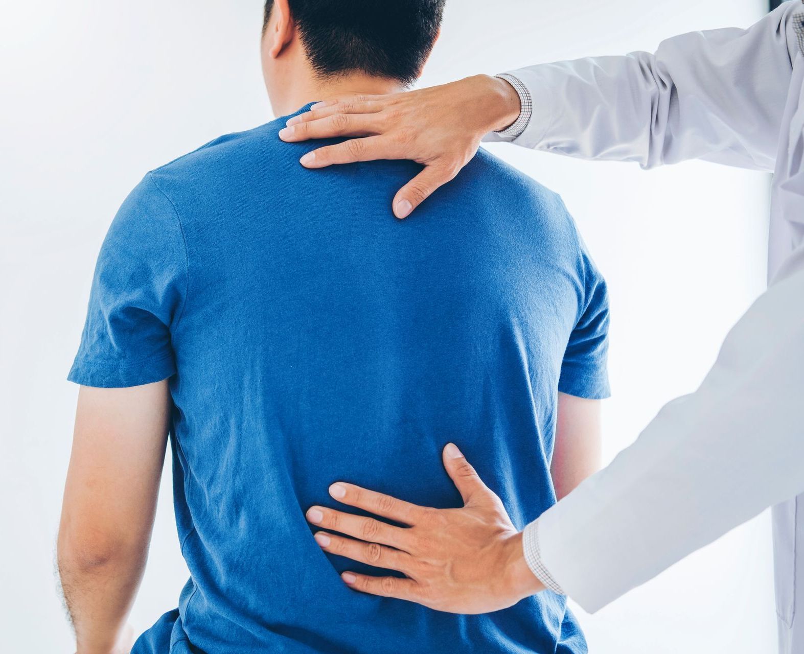Chiropractor in St. Charles adjusting a patients neck