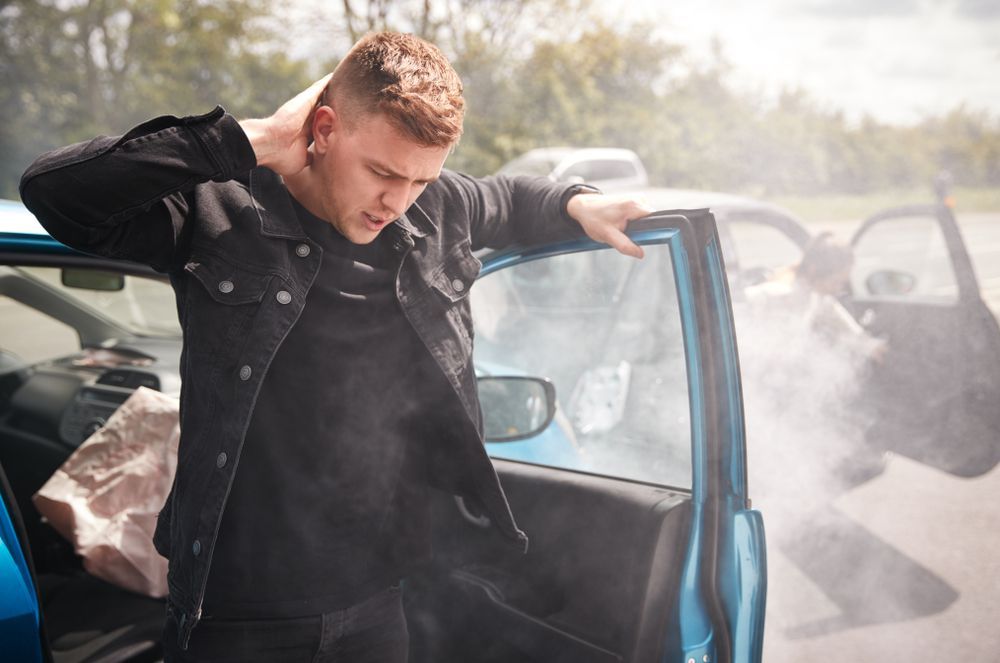 man getting out of the car after an accident