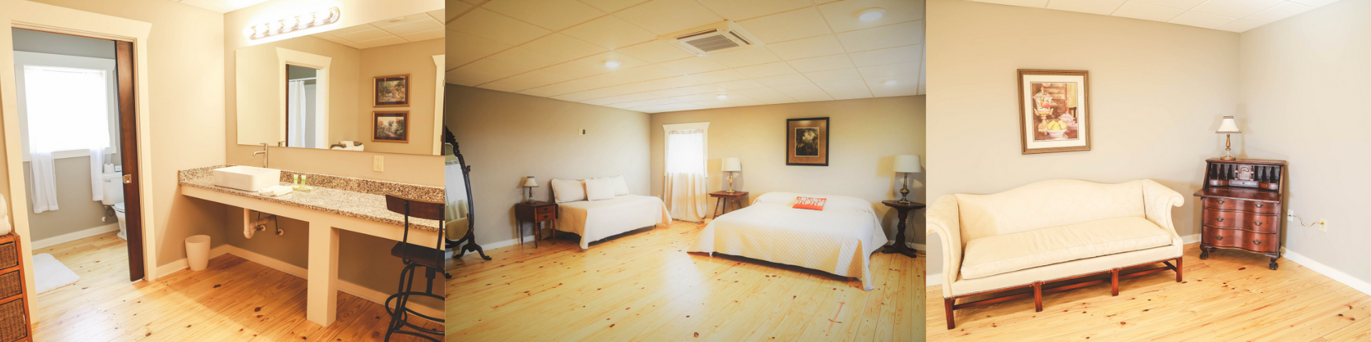 Bright beige bedroom with a wooden vanity, twin beds, and a small dresser in a carpeted room.